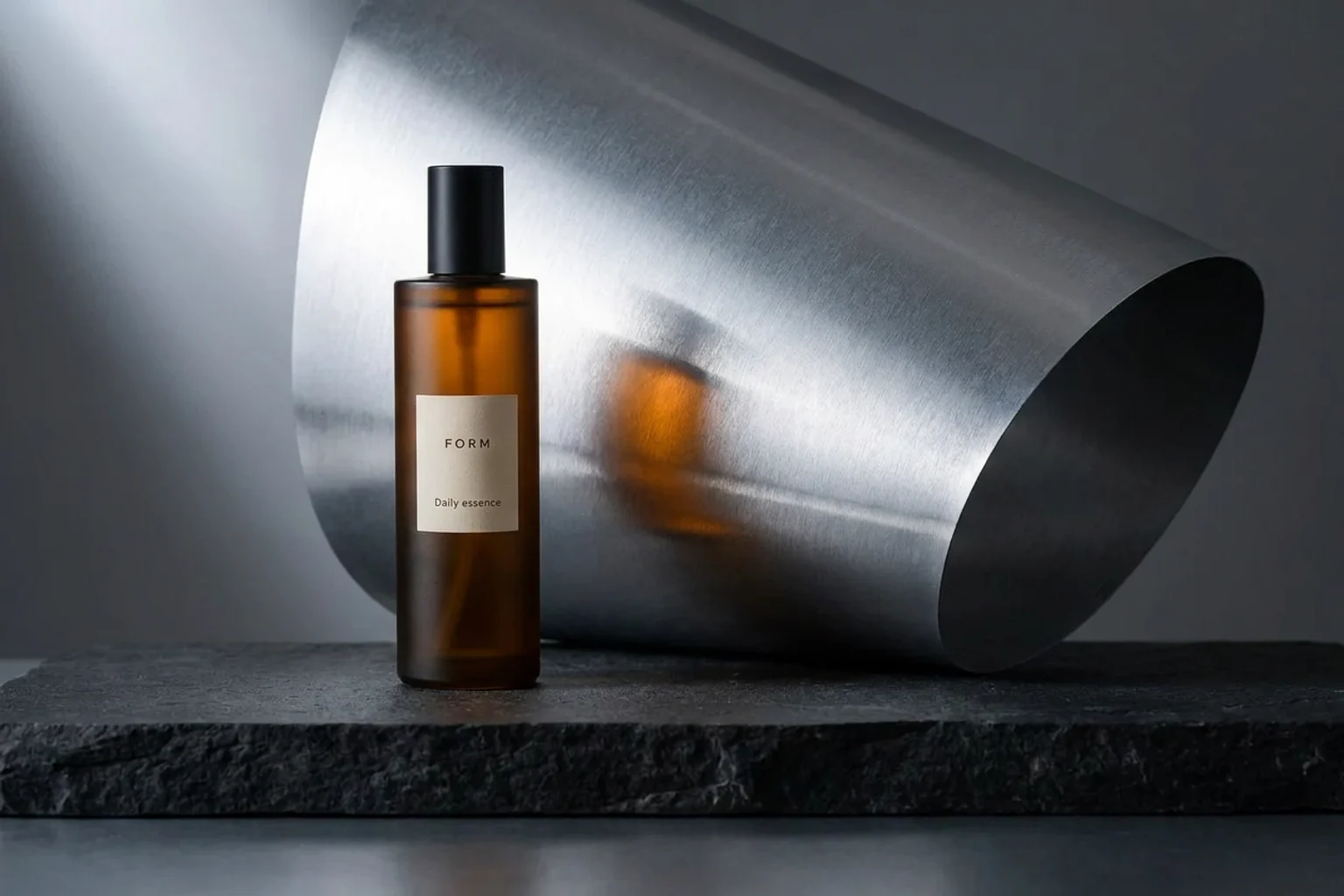 AI-generated alternative: the FORM bottle beside sculptural brushed aluminum on charcoal stone